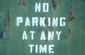 No parking on green metal surface